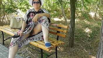 Chubby wife in transparent dress in public park upskirt video